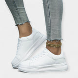Zapatillas de piel blanca