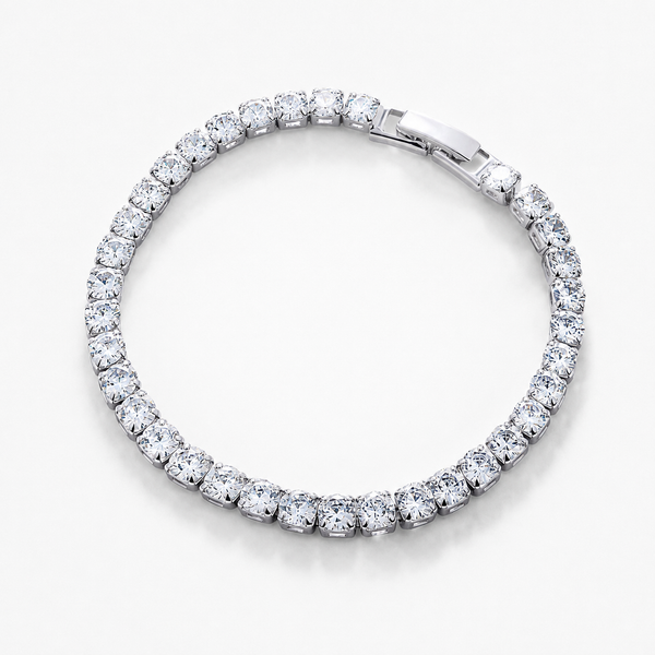 Pulsera rígida en acabado plateado formada por una línea continua de circonitas redondas engastadas