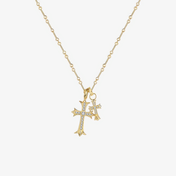 Collar de cadena de bolitas en acabado dorado con dos cruces de brazos abiertos, una grande y otra pequeña, cubiertas de circonitas