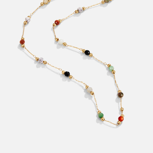 Collar largo de cadena fina con pequeñas piedras de colores repartidas